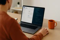 Image of a person working at a laptop